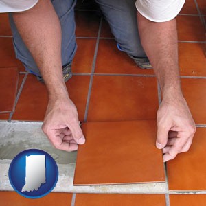 a tile worker laying ceramic floor tile - with Indiana icon