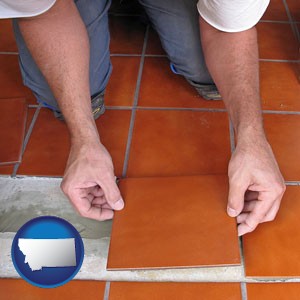 a tile worker laying ceramic floor tile - with Montana icon